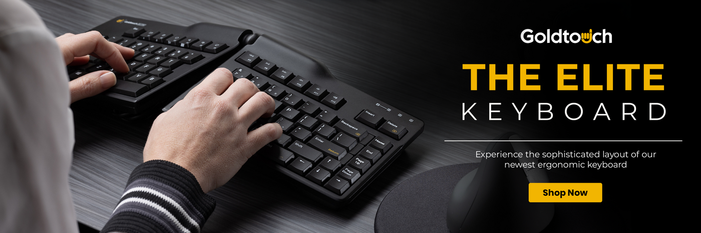 Person typing on a Goldtoch keyboard with promotional text for the Elite Keyboard.