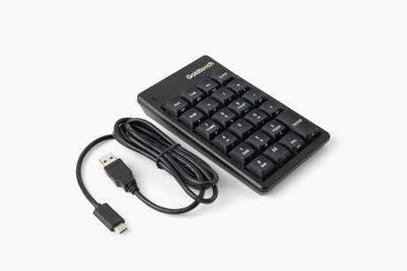 The Goldtouch Elite Numeric Keypad showing an angled view of the keys next to it's charging cable on a white background.