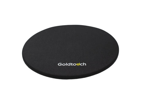 A black Round Mouse Pad with the Goldtouch logo on the bottom center.