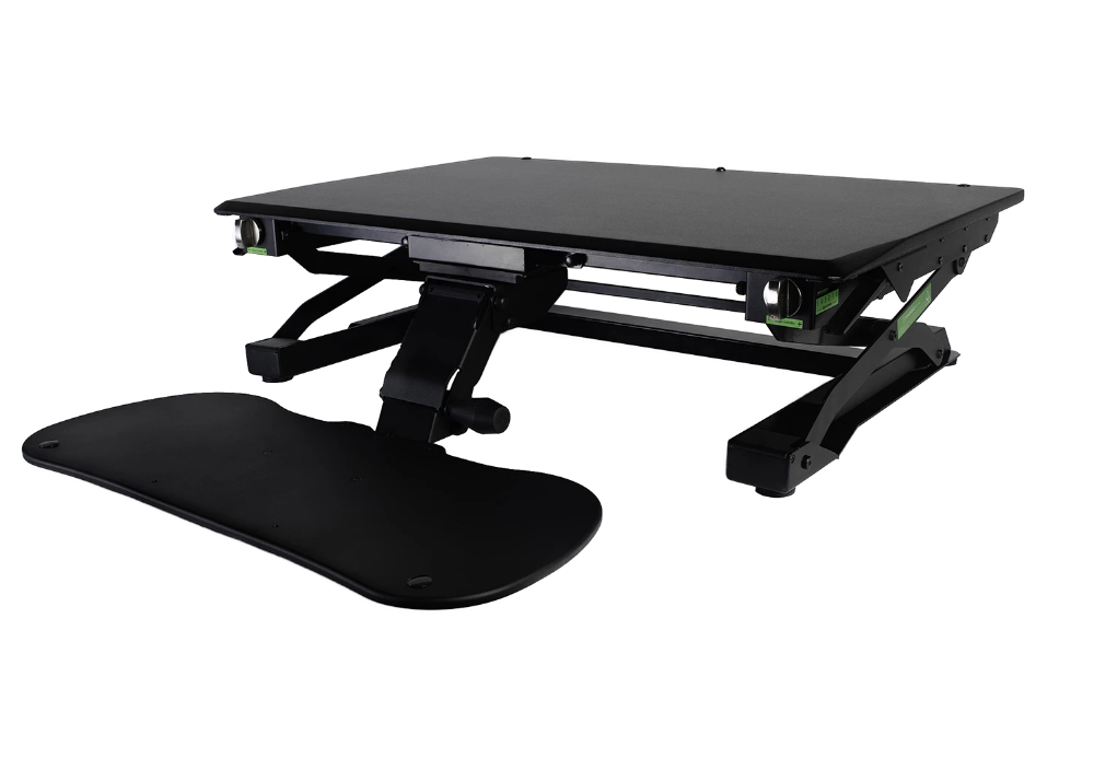 An image of a Goldtouch EasyLift Desk in a lowered position with the keyboard tray lowered and extended outwards.