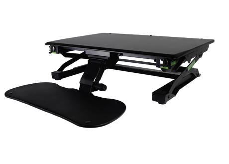 An image of a Goldtouch EasyLift Desk in a lowered position with the keyboard tray lowered and extended outwards.